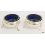 Pair of Georgian silver open salts with blue glass liners.