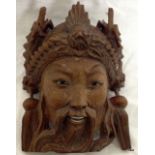 An Oriental carved rosewood warrior wall hanging , 16cm