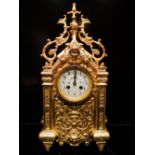 Victorian gilt cast brass French clock. 8 day sticking movement with flower decoration to the