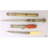 2 x Burmese silver covered daggers, one with ivory handle.