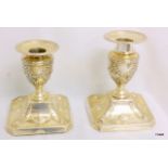 Pair of 10cm high Adams style silver candlestick.  Hallmarked silver London 1896.