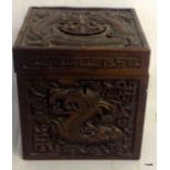 A Chinese rosewood tea caddy depicting dragons, 14.5cm tall x 14cm wide x 14cm deep