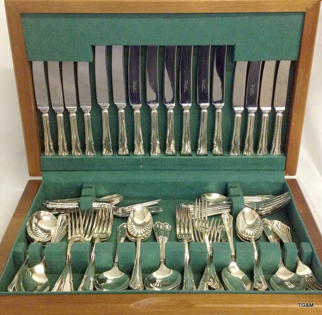 An Oak cased silver plated canteen of cutlery