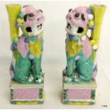 Pair of C19th Chinese famille rose incense holders in the form of seated Fo dogs.  23cm high.