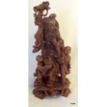 A large intricately carved Chinese root wood figural group 45cm high