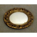 A round gilded mirror 45cm in diameter