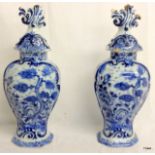 Pair of C18th Dutch Delft vases with ornate flame finial lids. 38cm high.