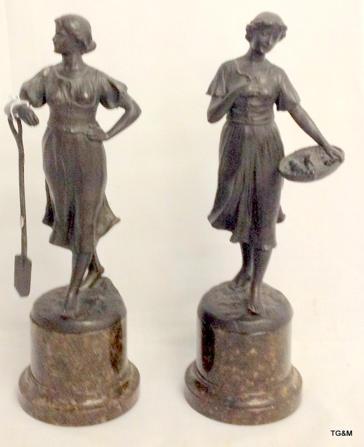 Pair of early C20th spelter figures of farm girls on serpentine marble bases.  29cm high.