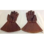 A Pair of vintage leather motorcycle gloves by Kett