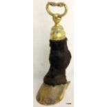 Novelty door stop made from horse's leg with nickel mounts.  44cm high.