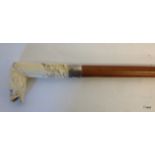 A carved ivory dog head walking stick