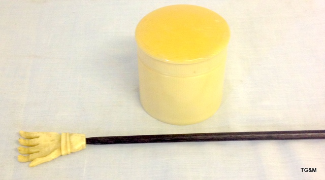 A Bone and ebony back scratcher and stud box