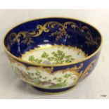 George Jones crescent china blue ground bowl with bird panels.  21.5cm in diameter.