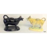 A Pair of pottery cow creamers