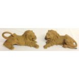 Pair of Chinese naturalistic Yixing pottery figures of lions.