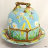 George Jones majolica cheese cover on stand, pale blue ground.  25cm high.
