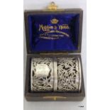 Cased pair of Chinese pierced silver napkin rings.  44gms.