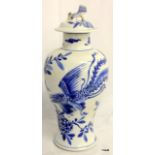 C17th Chinese blue and white baulster vase and lid, with Fo Dog finial and phoenix decoration.  27cm