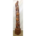 A large African Carving depicting 5 Elephants 140cm high