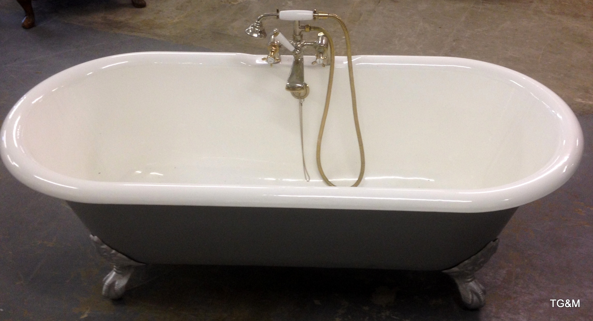 Steel and enamel bath with mixer taps