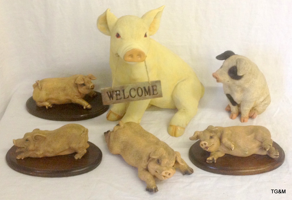 Six large models of pigs