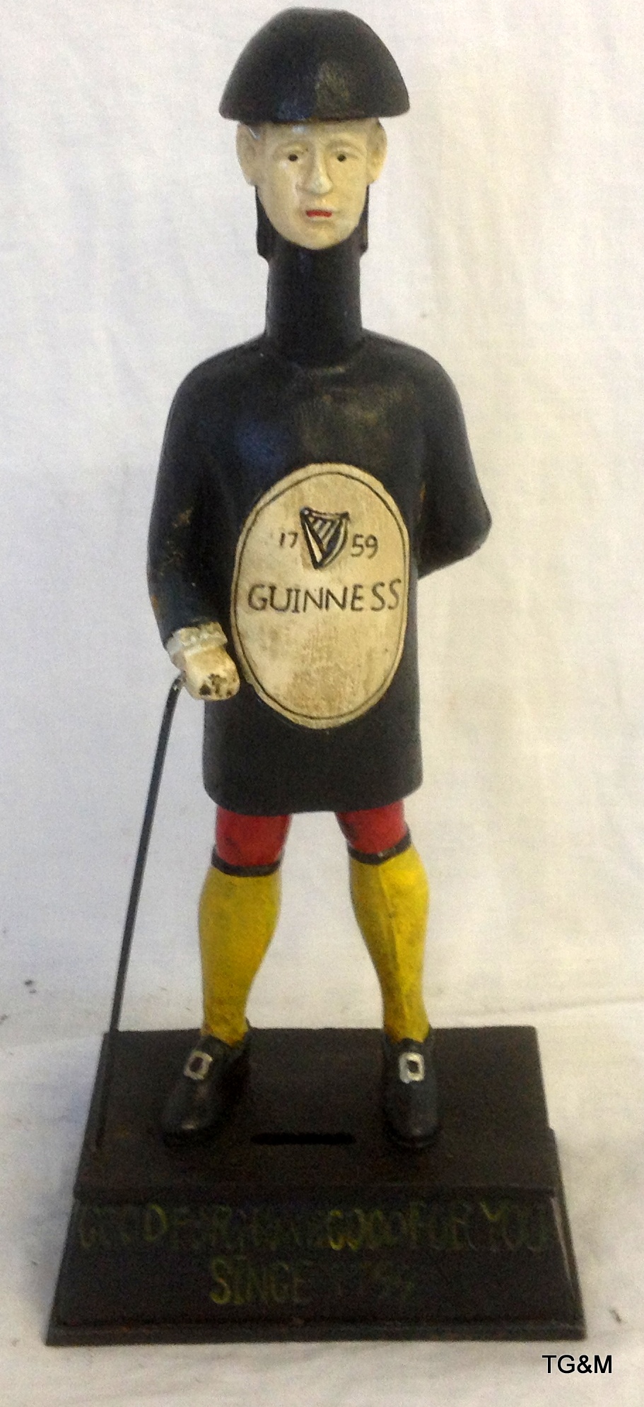 Guiness money box figure in cast iron