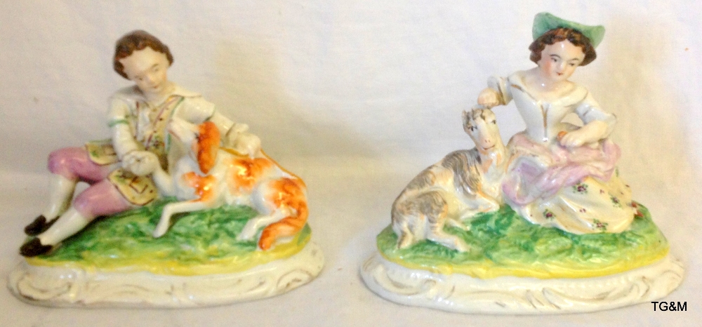 Pair of Staffordshire reclining figures with goats