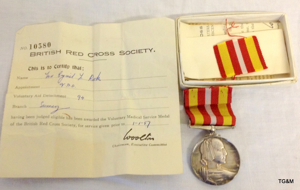 A Voluntary Medical Service medal with documents to Cyril L Rook