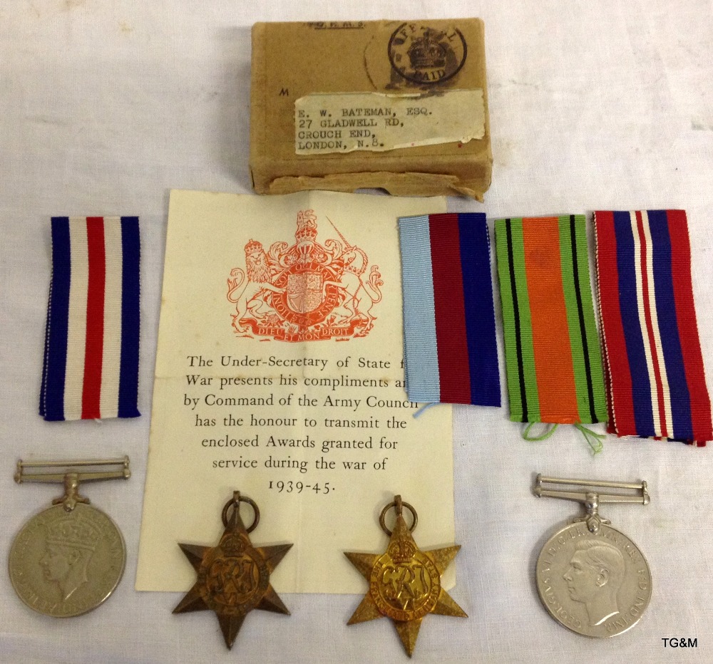 A WW2 medal group of four with document & posting box to EW Bateman