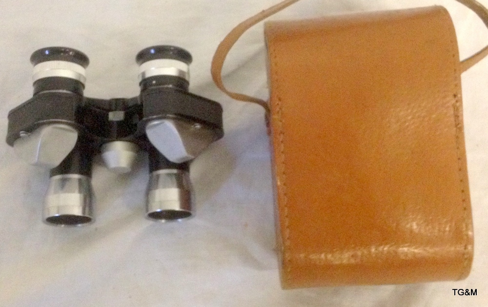 A pair of "Green Cat" binoculars in leather case (8x25)