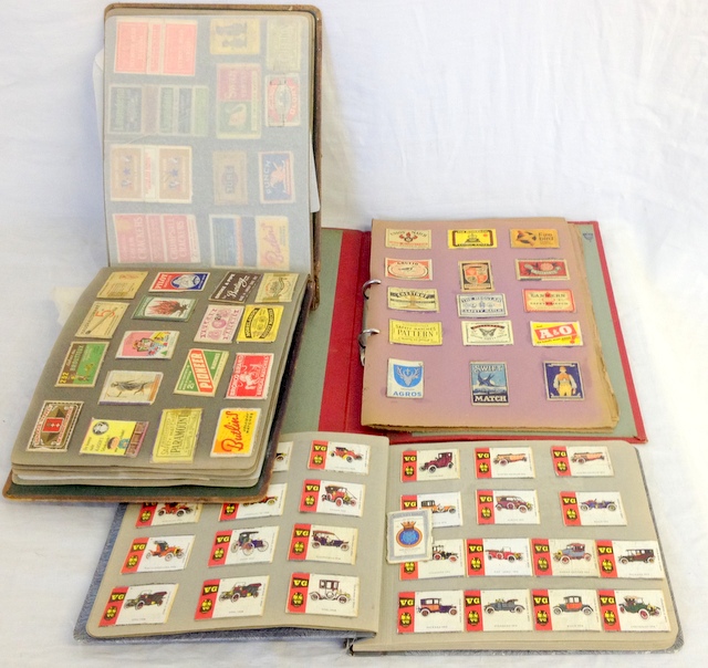 Three albums containing a collection of match boxes