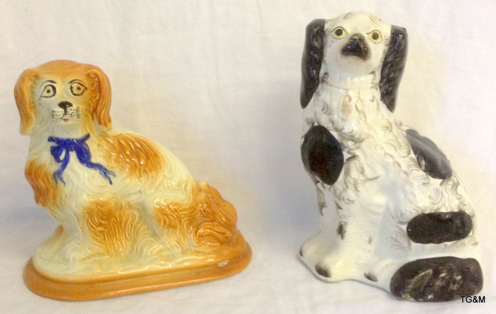 Two Staffordshire pottery dogs