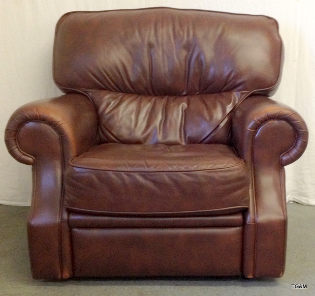 Brown leather reclining arm chair