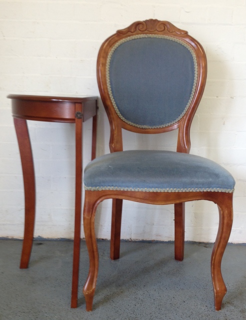 Blue upholstered side chair and small corner table