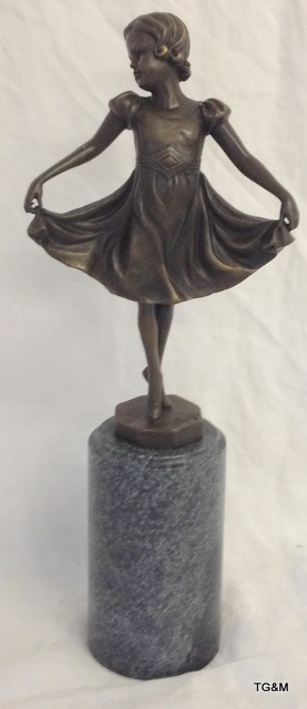 A bronze figure of a little girl