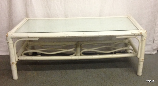 A white painted bamboo effect coffee table