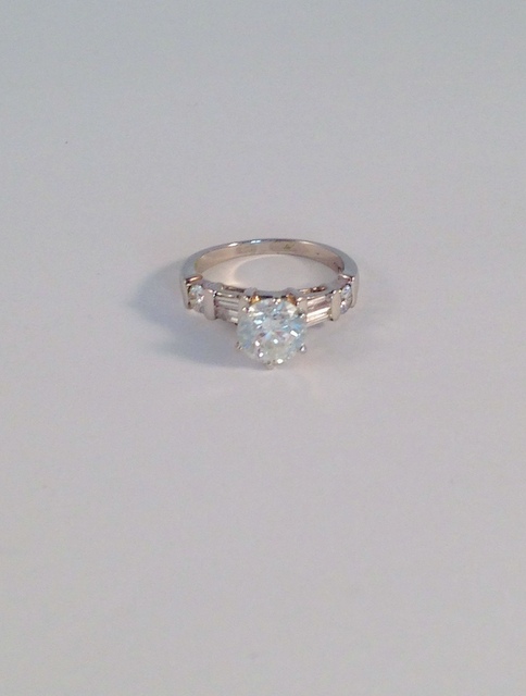 Platinum set diamond ring, approx 1.6ct with baguette diamonds set to the shoulders