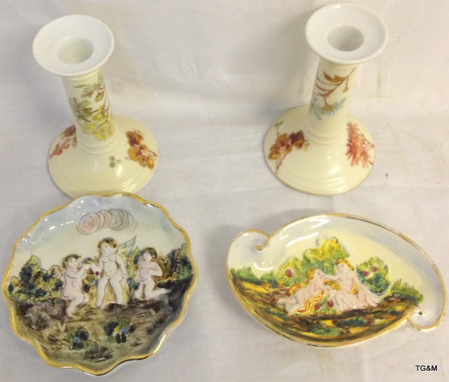 Pair of Limoges candle sticks with a pair of Capodimonte cherub dishes