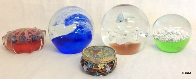 Four glass paperweights and decorative pill box