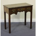 A 20th Century George III style oak lowboy, the moulded rectangular top above an arrangement of