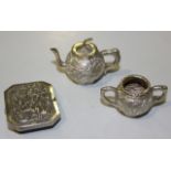 A Chinese silver miniature teapot and cover and matching two handled sugar bowl, each globular