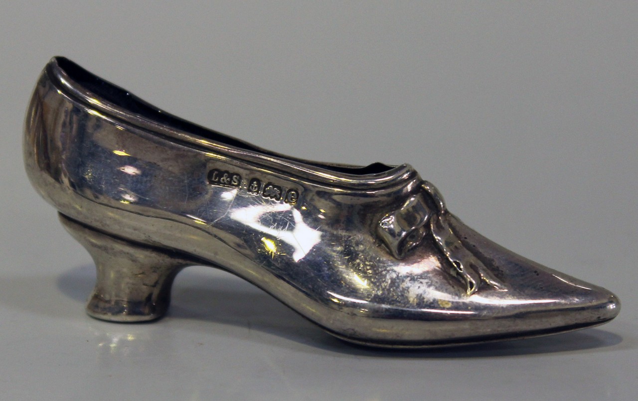 An Edwardian silver novelty pin cushion in the form of a shoe, Birmingham 1904 by Levi & Salaman,