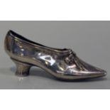 An Edwardian silver novelty pin cushion in the form of a shoe, Birmingham 1904 by Levi & Salaman,
