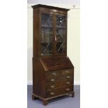 A 20th Century reproduction mahogany bureau bookcase, fitted with astragal glazed doors above a fall