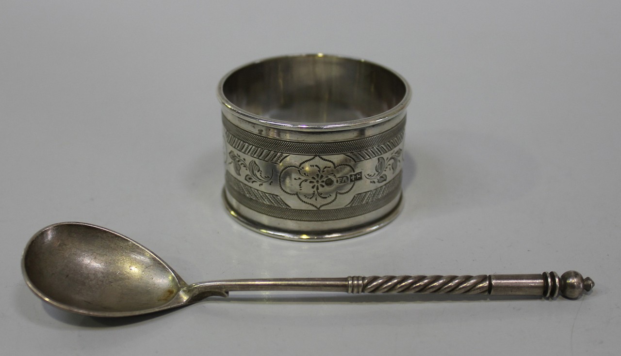 A mid-19th Century Russian silver circular napkin ring, 84 zolotnik, with engraved scrolls and