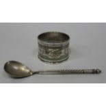 A mid-19th Century Russian silver circular napkin ring, 84 zolotnik, with engraved scrolls and