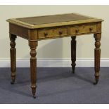 A Victorian oak writing table, the moulded top above two frieze drawers, on turned and reeded