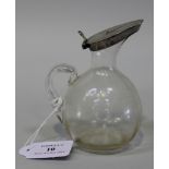 A Victorian silver mounted glass whisky tot, the clear glass globular body and loop handle fitted