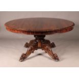 A 19th Century rosewood and figured walnut tip-top breakfast table, the circular top with a reeded