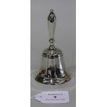 An Edwardian silver desk bell with turned handle, London 1903 by Harry Brasted, height approx 12cm.